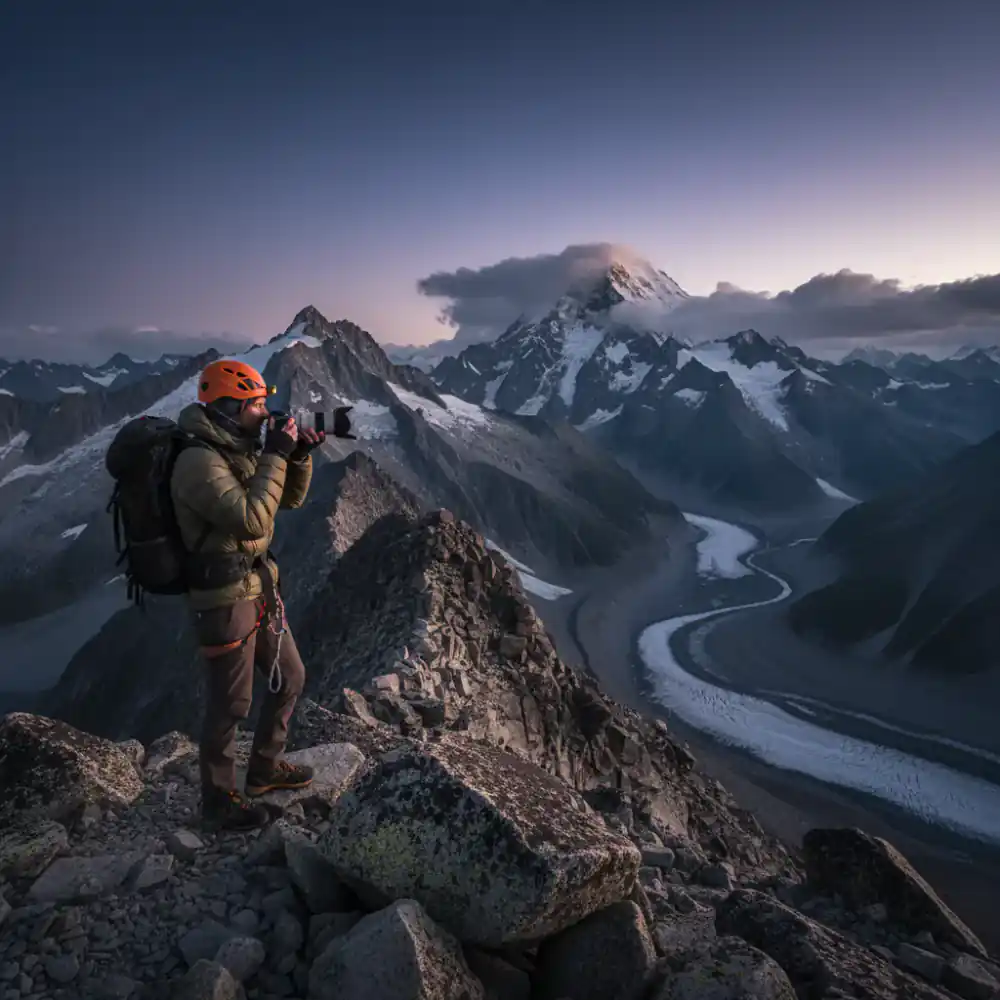 Lead guide taking photos in high mountains